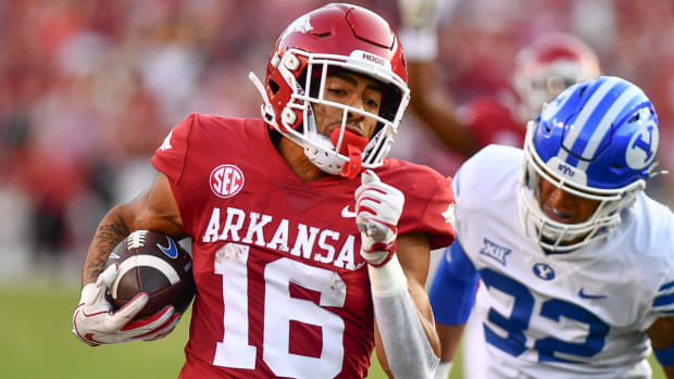 Razorbacks wide receiver Isaiah Sategna after an 88-yard punt return.